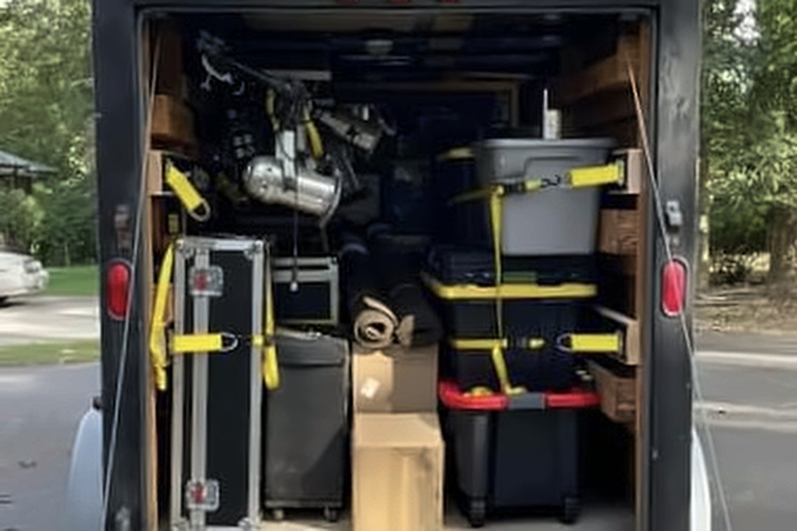 WhereWithHaul enclosed trailer, doors open, load strapped down